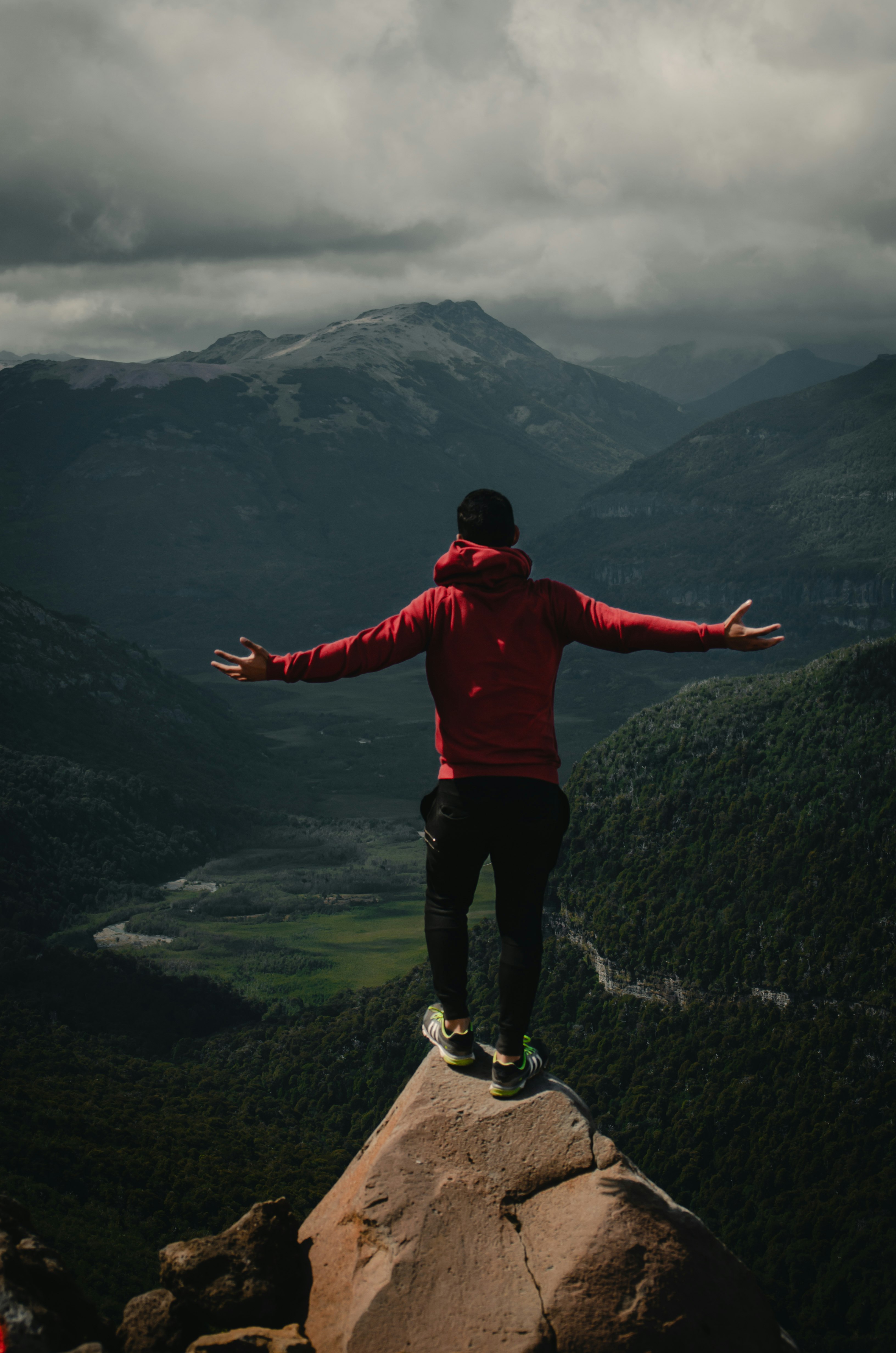 man standing on cliff